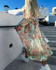 Printed dress with slit and V-neck