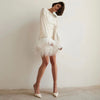 Glamorous dress with sequins and feather hem