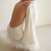 Glamorous dress with sequins and feather hem