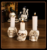 GothicGlow™ 3pc Halloween Skull Candle Holder Set